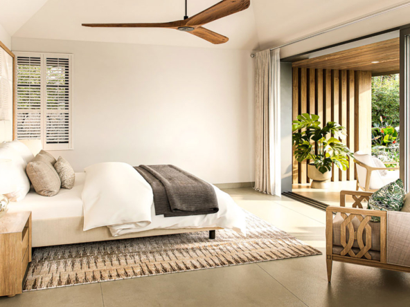 Chambre avec vue lagon et décoration naturelle dans une villa haut de gamme