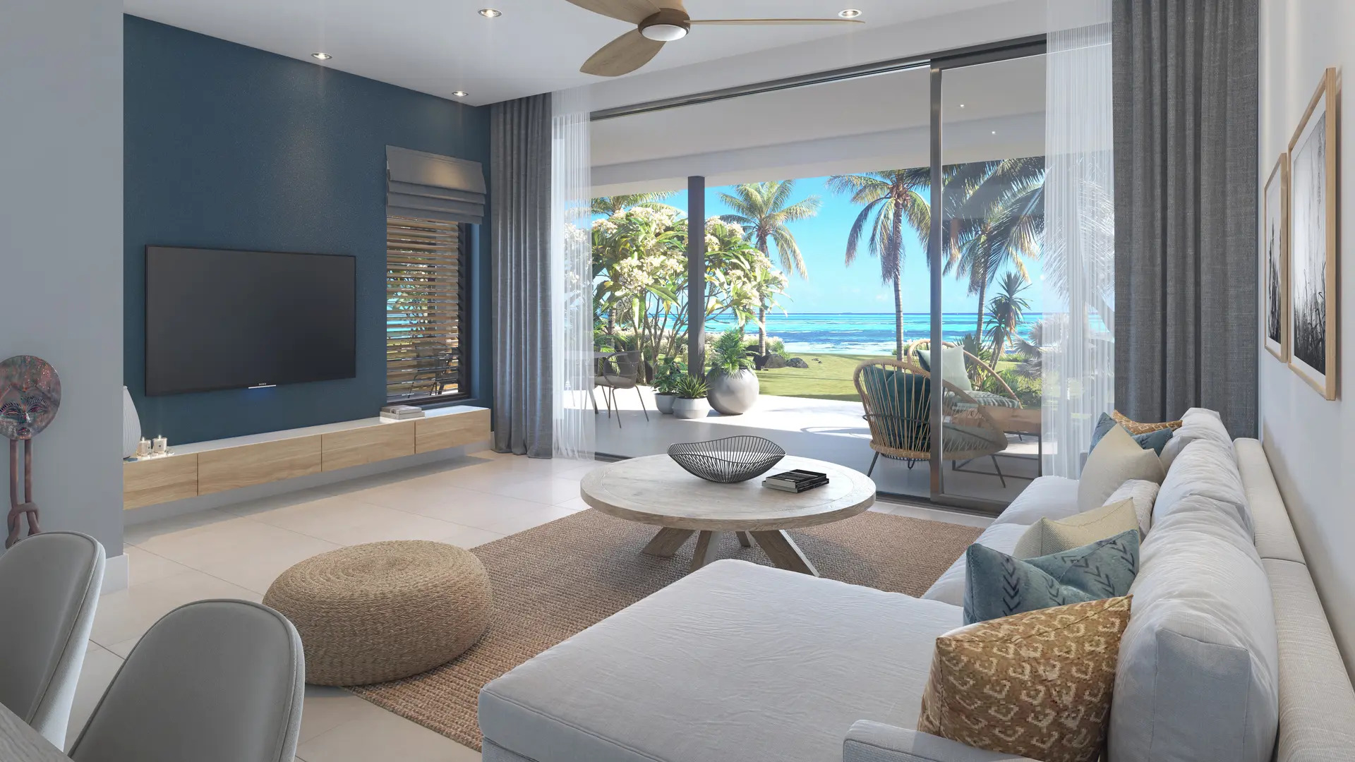 Salon spacieux avec vue sur la terrasse et Le Morne, dans une résidence front de mer haut de gamme à l’île Maurice – Ohana Heritage Group