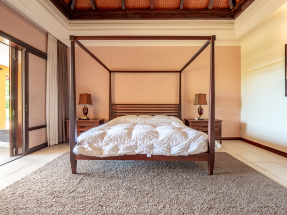 Master bedroom suite with tropical decor in Ohana Heritage Group’s Tamarina property